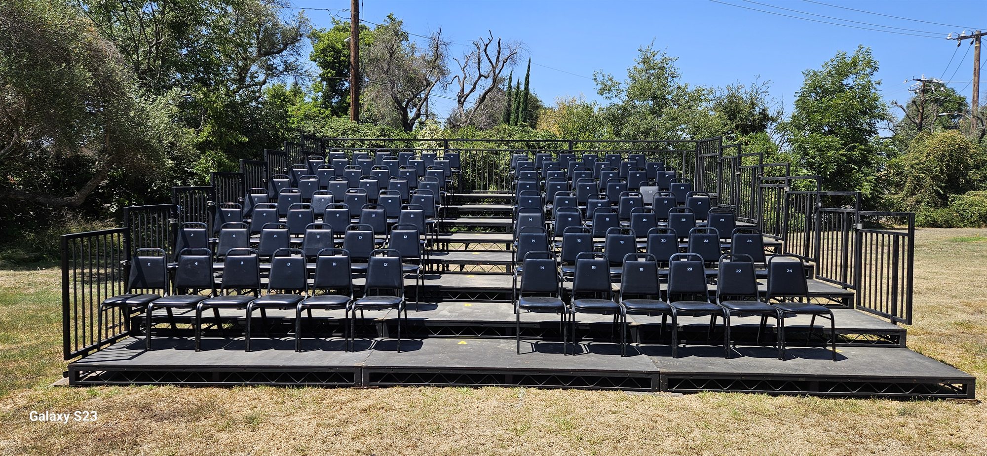 Outdoor tiered chair risers with black seating