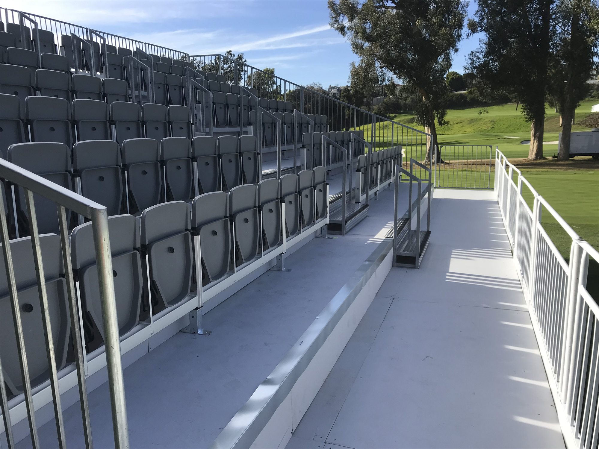 Tiered tip-up seating with accessible circulation space